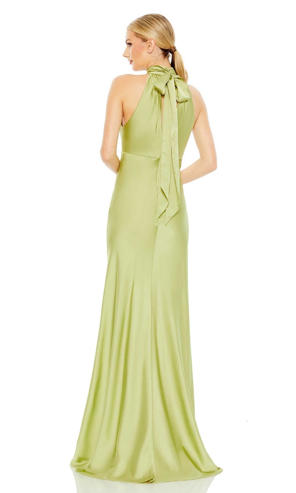 A woman wearing the Long Formal Dress 49520 by Mac Duggal, featuring a stunning green color and high neck design.